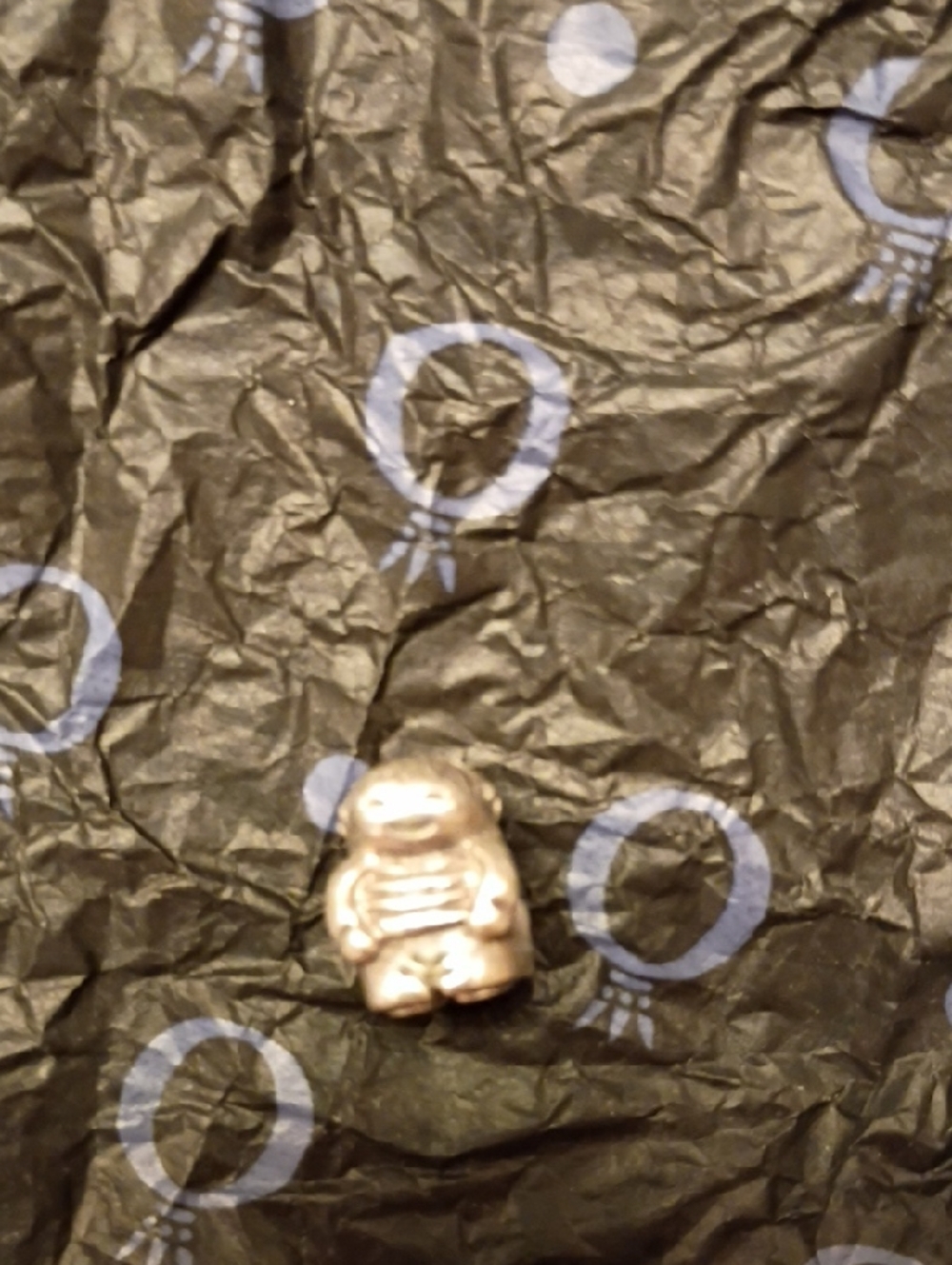 Pandora Silver Astronaut Charm on Cream Pouch